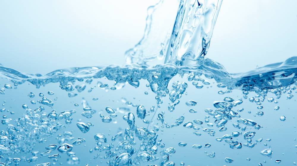blue background with bubble splash | The Evidence Behind the Use of Hydrogen Water to Improve Your Health