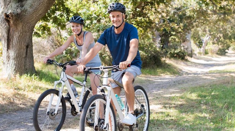 Portrait of senior couple riding cycle in the park…enefits Of Boosting Your Immune System | feature | 3 Significant Benefits Of Boosting Your Immune System