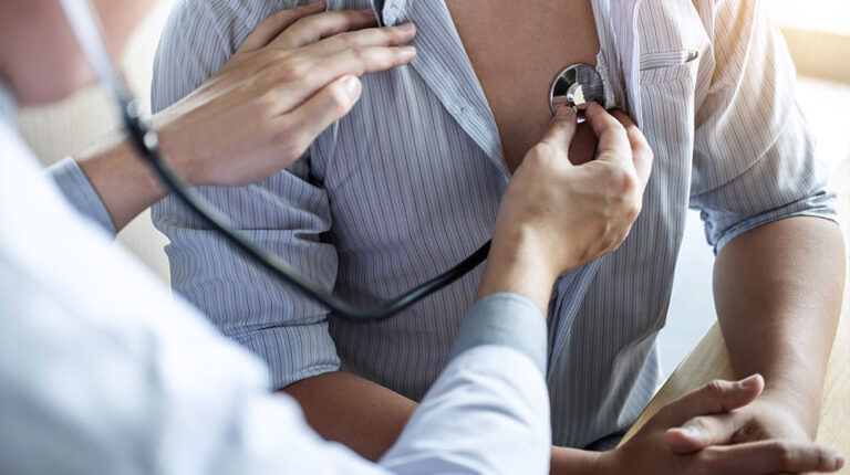 Doctor-using-a-stethoscope-checking-patient-with-examining-What-is-Chelation-Therapy-Important-Risk-Factors-You-Need-to-Know