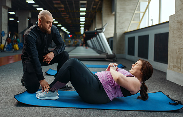 Overweight-woman-with-trainer,-exercise-on-mat---How-to-Treat-Sarcopenic-Obesity---as-body