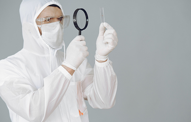 photo-of-person-using-magnifying-glass-while-holding-a-glass-slide-Challenges-and-Limitations-of-Biological-Age-Testing