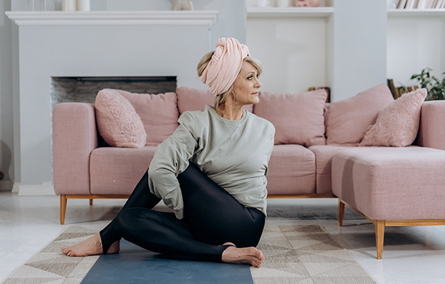 Woman-Working-Out-in-a-Living-Room-How-Can-You-Delay-Ovarian-Aging-px-body