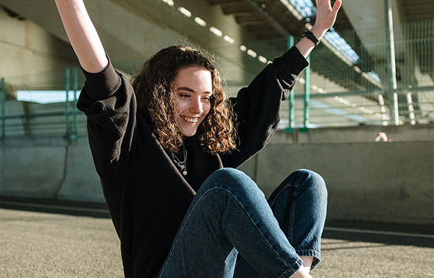 Woman-in-Black-Jacket-and-Blue-Denim-Jeans-Sitting-on-Gray-Concrete-Floor-DHH-B-for-Stress-Relief-Understand-The-Magical-Mechanism-px-body